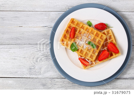 Belgian waffles with strawberries Belgian waffles with strawberries 31679075