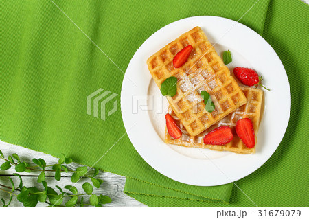 Belgian waffles with strawberries Belgian waffles with strawberries 31679079