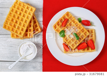 Belgian waffles with strawberries Belgian waffles with strawberries 31679081