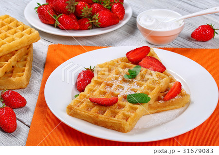 Belgian waffles with strawberries 31679083