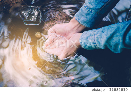 close up Water in the hands of women. 31682650