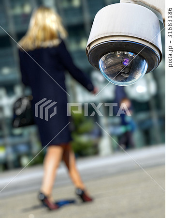 security CCTV camerawith woman on background 31683186