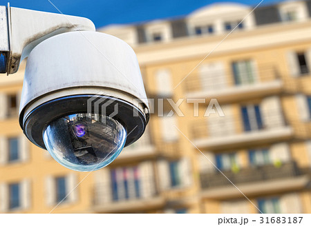 security CCTV camera with residence on background 31683187