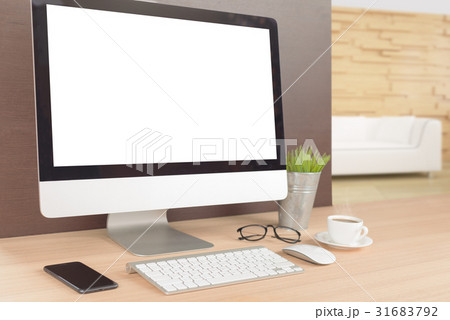 computer on work table showing white screen 31683792