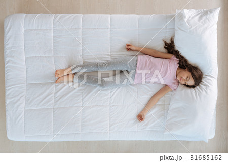 Cute little girl sleeping on the bed 31685162