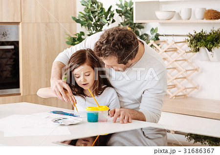 Father helping his daughter in painting Father helping his daughter in painting 31686367