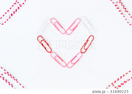 heart shape by paper clips on white background heart shape by paper clips on white background 31690225
