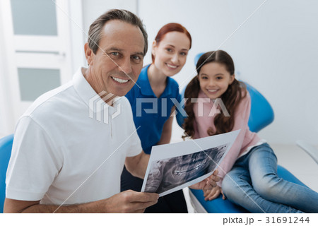 Portrait of handsome man that holding jaw X-ray Portrait of handsome man that holding jaw X-ray 31691244