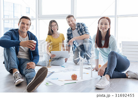 Handsome cheerful man holding a cup of coffee 31692455