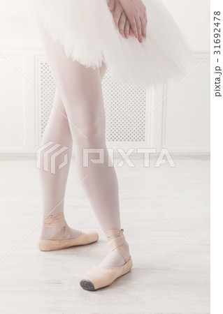 Ballerina legs closeup in fourth position 31692478
