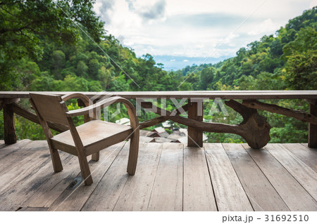 Wooden armchair on terrace inside rainforest Wooden armchair on terrace inside rainforest 31692510
