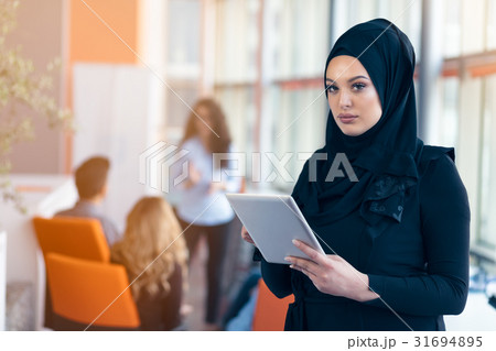 beautiful Arabian girl with tablet computer beautiful Arabian girl with tablet computer 31694895