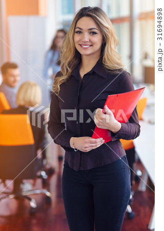 Team work discussing. Young woman with paper Team work discussing. Young woman with paper 31694898