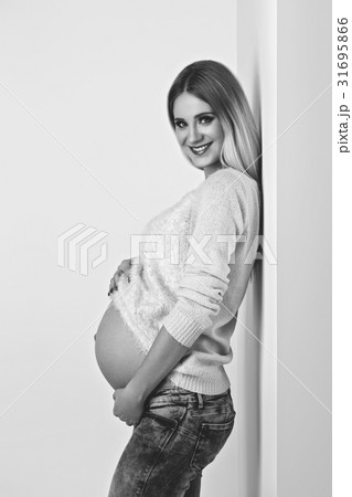 Beautiful pregnant woman in jeans 31695866