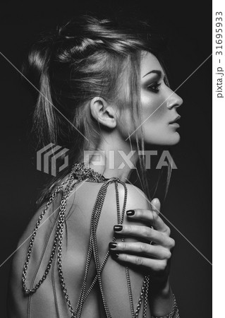 beautiful girl with many golden and bronze chains beautiful girl with many golden and bronze chains 31695933