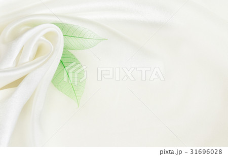 White silk background with flower drapery White silk background with flower drapery 31696028