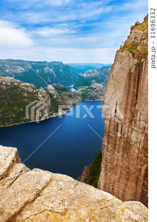 Cliff Preikestolen in fjord Lysefjord - Norway Cliff Preikestolen in fjord Lysefjord - Norway 31696332