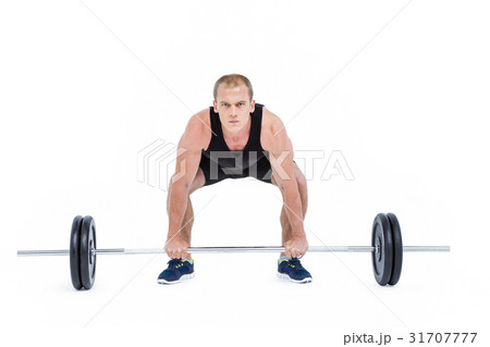 Bodybuilder lifting heavy barbell weights 31707777