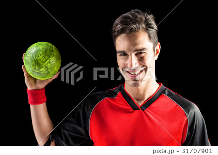 Portrait of happy athlete man holding a ball 31707901