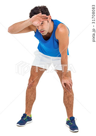 Tired athlete wiping his sweat with hand 31708083