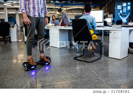 Hipster on a smart balance board 31708581