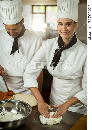 Two head chefs making pizza dough Two head chefs making pizza dough 31709029