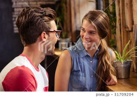 Smiling couple talking Smiling couple talking 31709204
