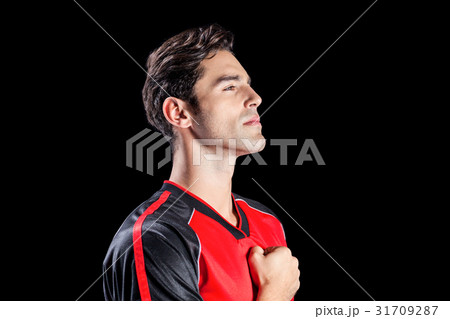 Athlete showing respect during national anthem 31709287