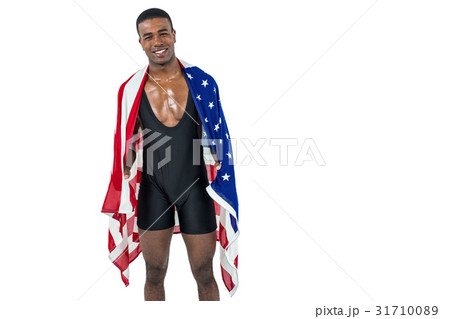 Athlete with american flag wrapped around his body Athlete with american flag wrapped around his body 31710089