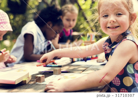 Group of children drawing imagination outdoors Group of children drawing imagination outdoors 31710307