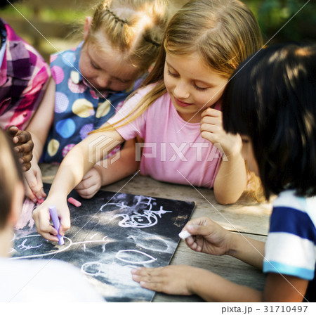 Group of Diverse Kids Drawing on Chalkboard Together 31710497