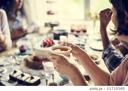 Friends Gathering Together on Tea Party Eating Cakes Enjoyment h 31710560