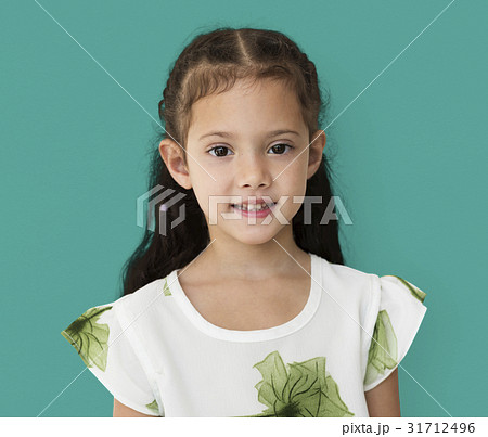 Young little girl with awkward smile expression portrait 31712496