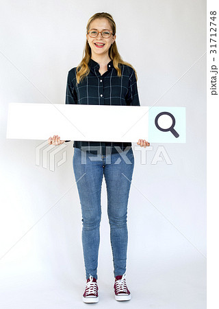 Woman standing and holding banner Woman standing and holding banner 31712748