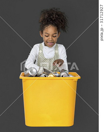 Little Girl Separating Recyclable Metal Can Studio Portrait 31712927