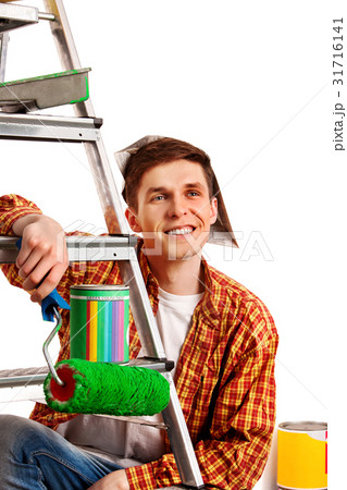 Repair home man holding paint roller for wallpaper 31716141