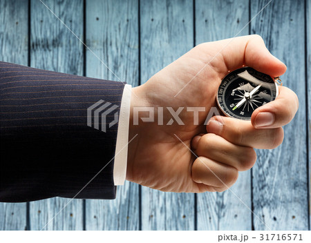 Compass in male hand 31716571