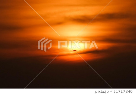 silhouette Airplane in the air with sunset 31717840