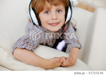 Beautiful brilliant child listening to music 31723236