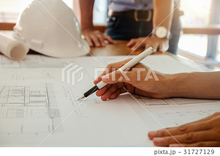 Architects engineer discussing at the table Architects engineer discussing at the table 31727129