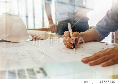 Architects engineer discussing at the table  31727130