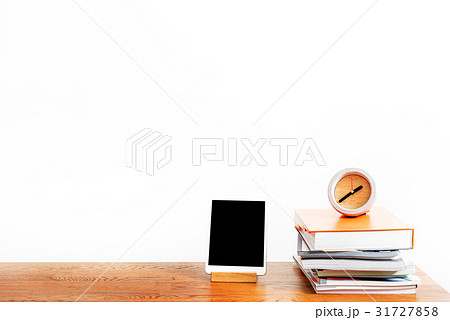 Gadget and stack of notebooks with watch on Gadget and stack of notebooks with watch on 31727858