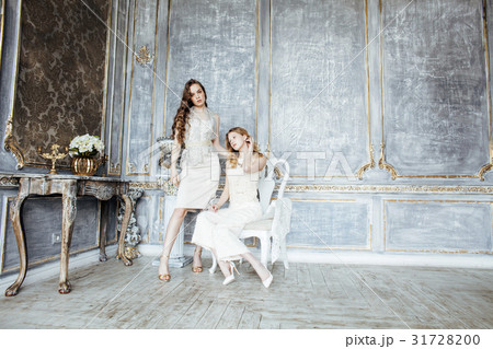 two pretty twin sister blond curly hairstyle girl two pretty twin sister blond curly hairstyle girl 31728200