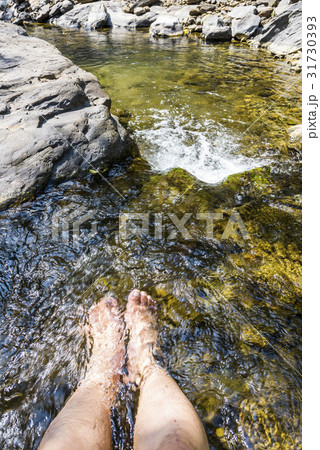 Foot soak to relax in brook 31730393