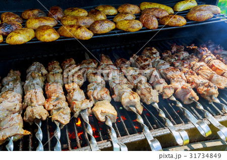 BBQ meat and potato on grill 31734849