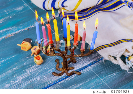 The Jewish menorah with candles, sweet donuts, The Jewish menorah with candles, sweet donuts, 31734923