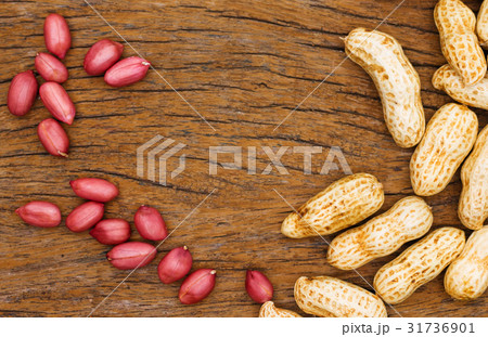 red peanuts on wood 31736901