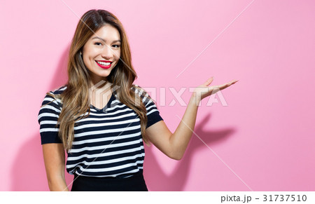 Young woman with displaying hand gesture 31737510