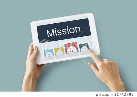 Hands working on digital device network graphic overlay 31742795