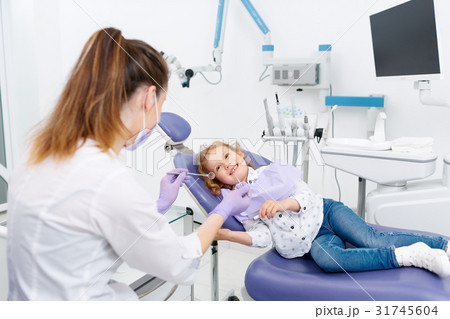 Smiling little patient at dentist Smiling little patient at dentist 31745604